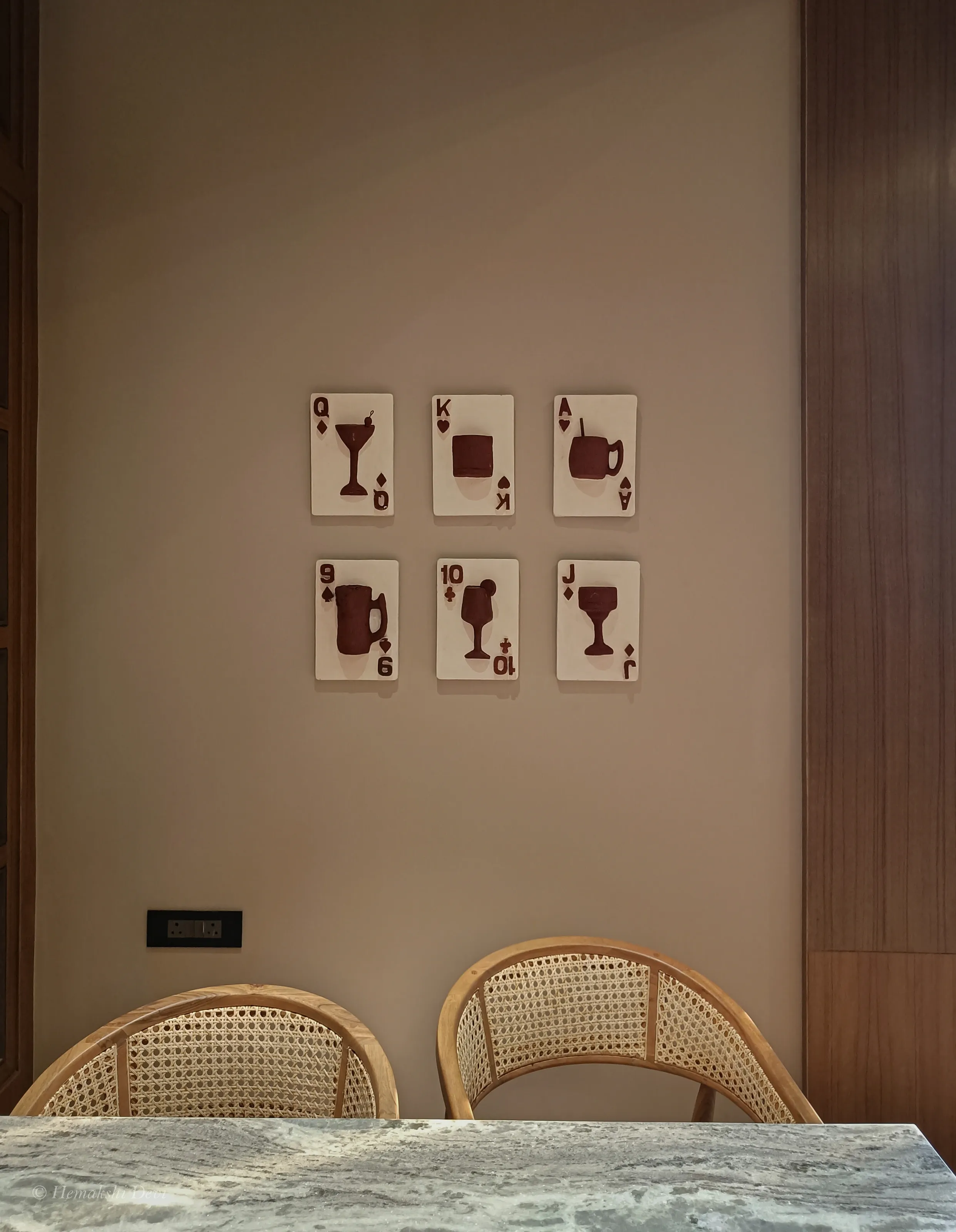 Detail of a playing-card relief on the Joha Brew bar wall
